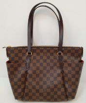 A Louis Vuitton Damier Ebene 'Totally PM' Shoulder Bag. Canvas exterior with gold-toned hardware,