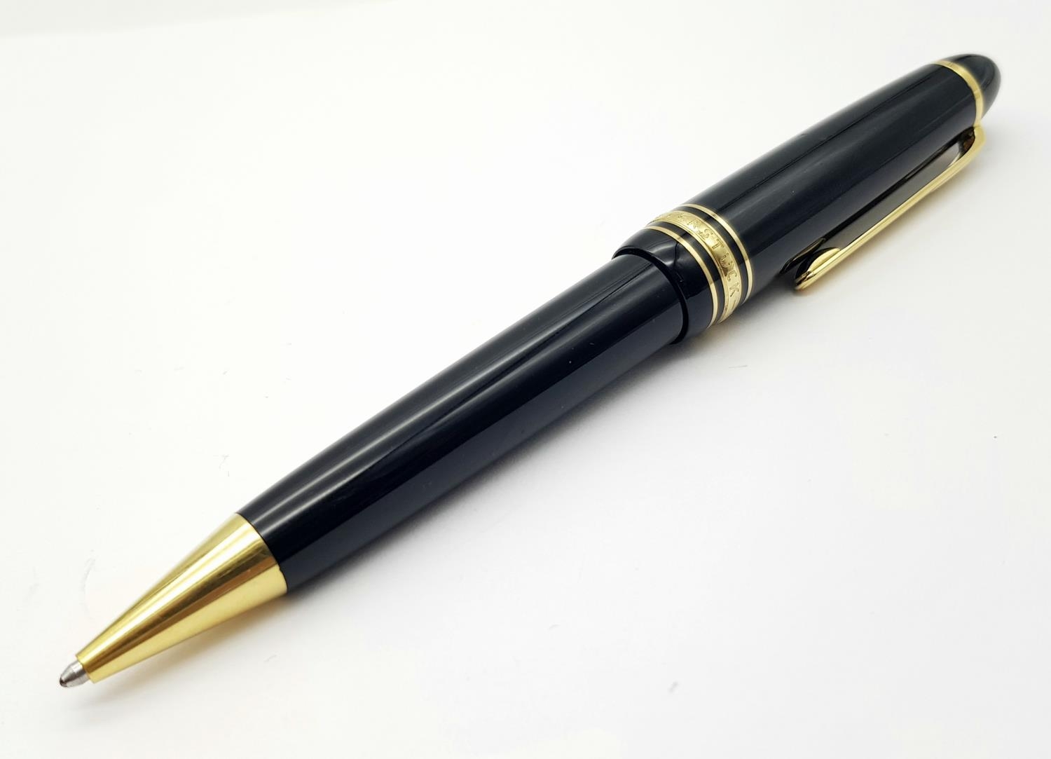 A Montblanc Meisterstruck Black and Gold Tone Ball Point Pen. 15cm. Ref: 016938