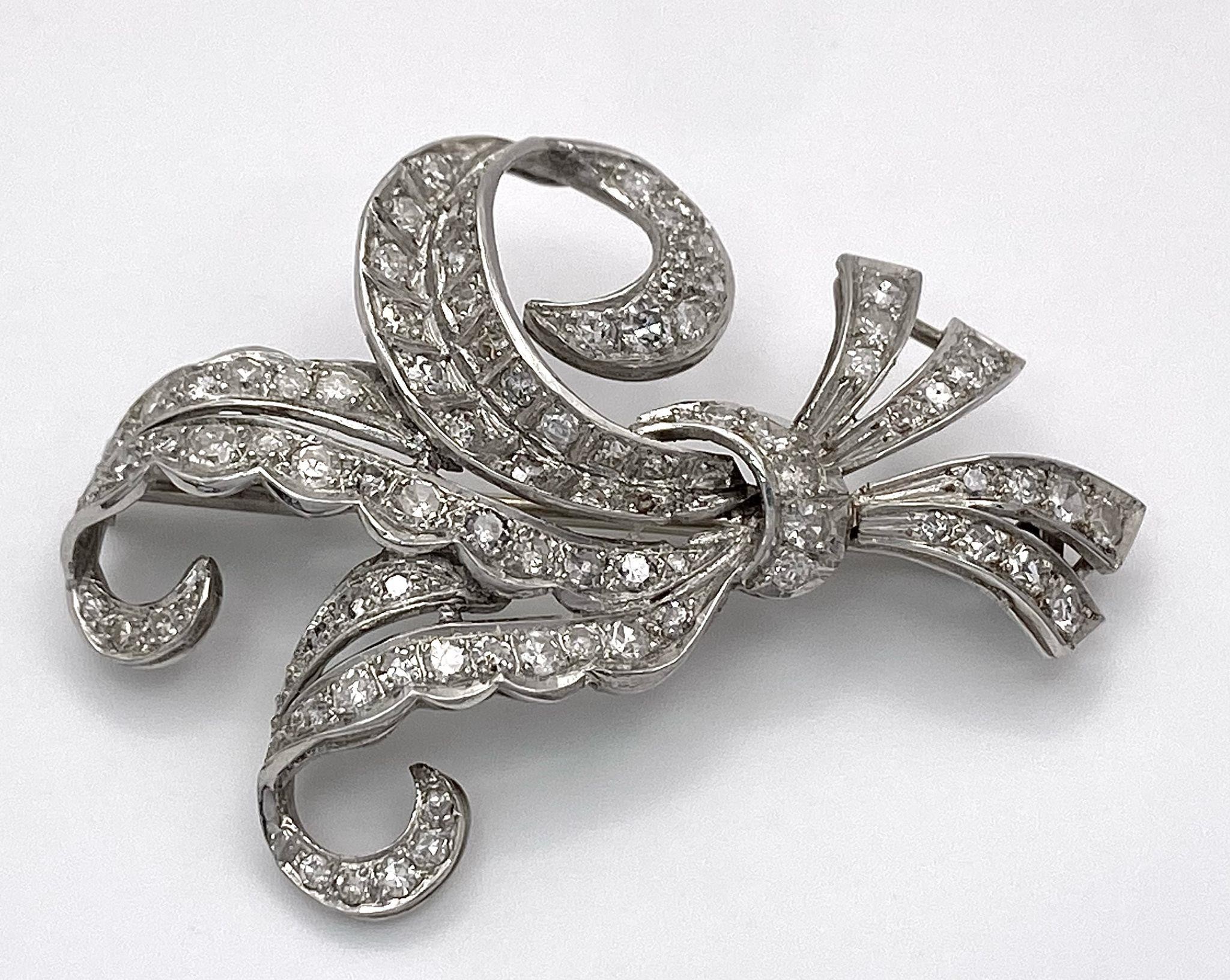 A Vintage Style Platinum and Diamond Elaborate Bow Brooch. 2.2ctw of encrusted diamonds. 10.7g total