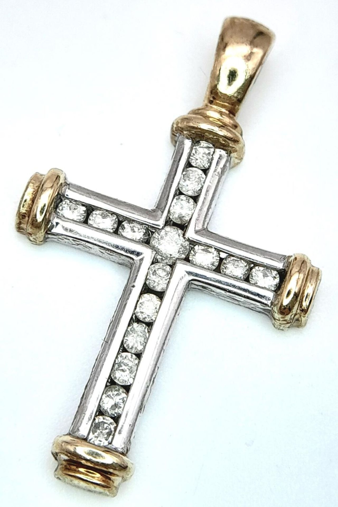 A 9K TWO GOLD-TONE DIAMOND SET CROSS 0.15CT 2.3G , 26MM X 15MM. SC 9013