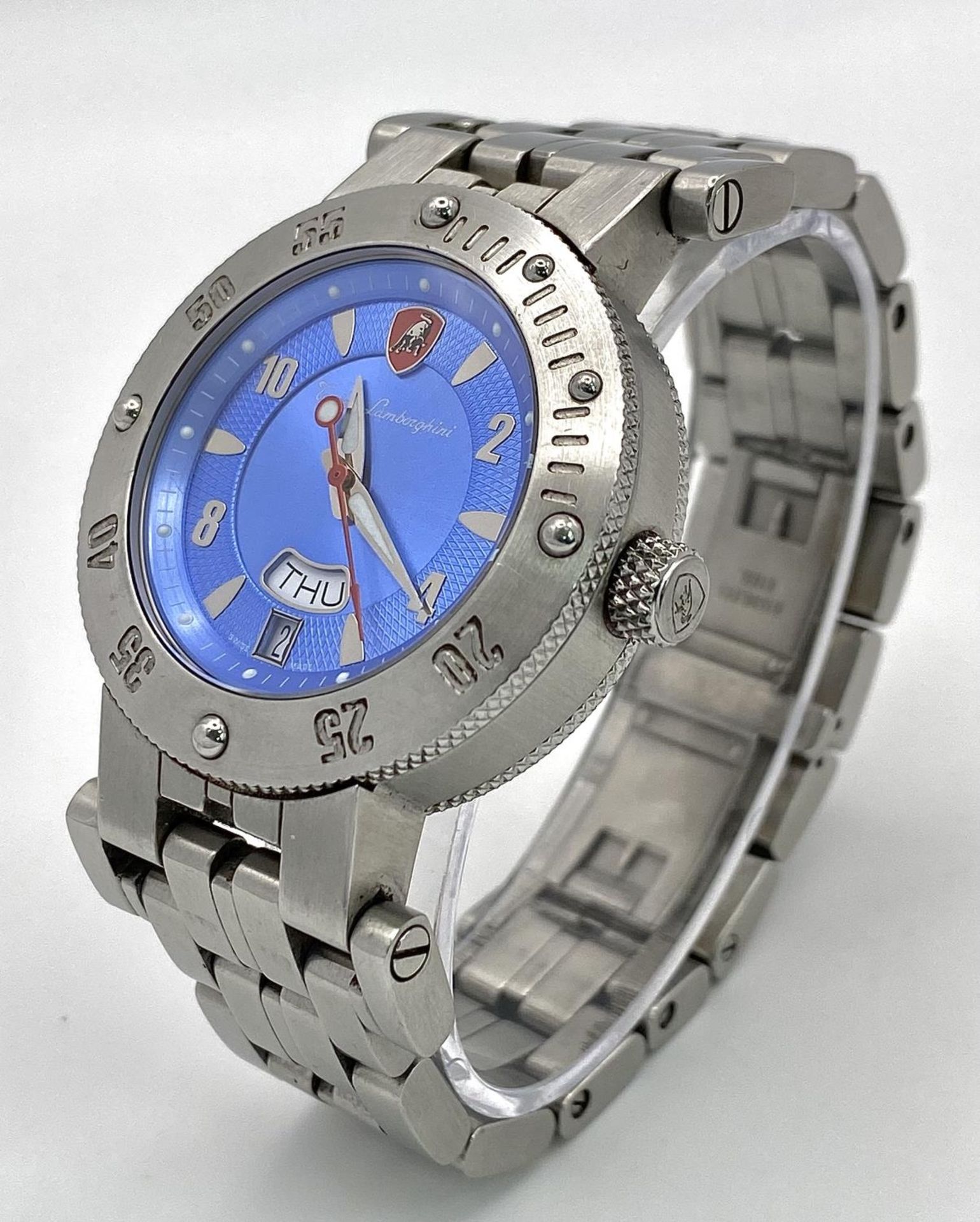 A Lamborghini Automatic Gents Watch. Stainless steel bracelet and case - 38mm. Blue dial with day/
