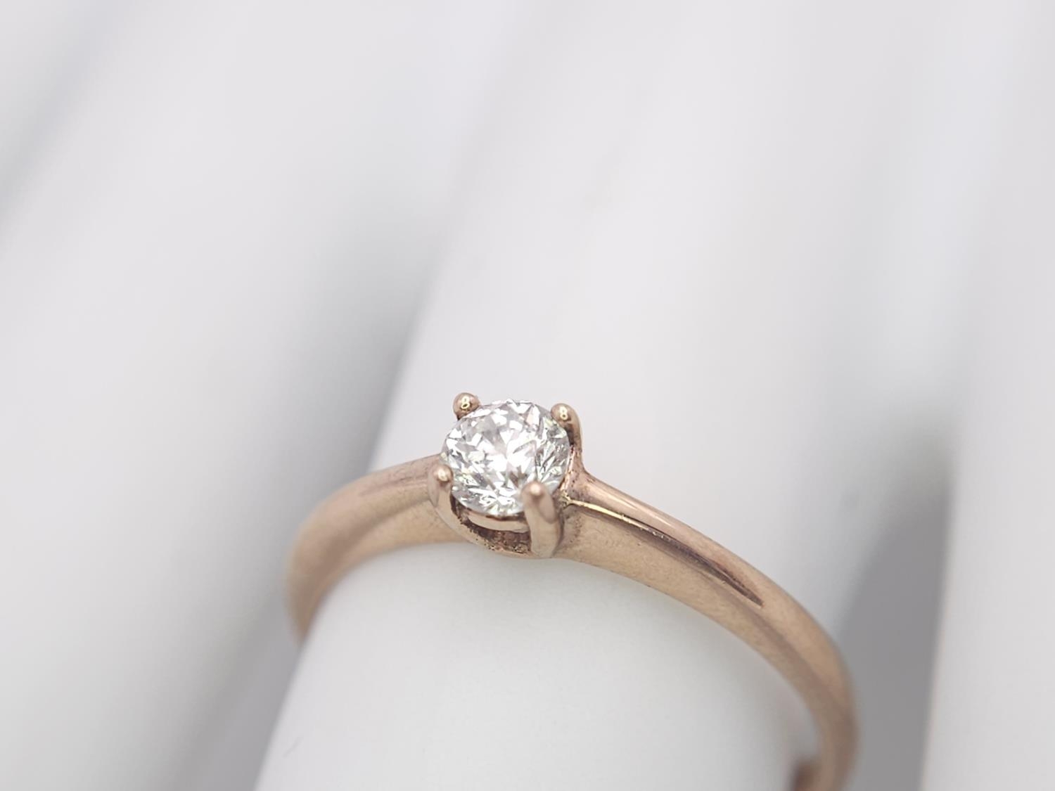 A 9K Rose Gold Diamond Solitaire Ring. 0.10ct round cut diamond. Size N. 2g total weight. - Image 7 of 7