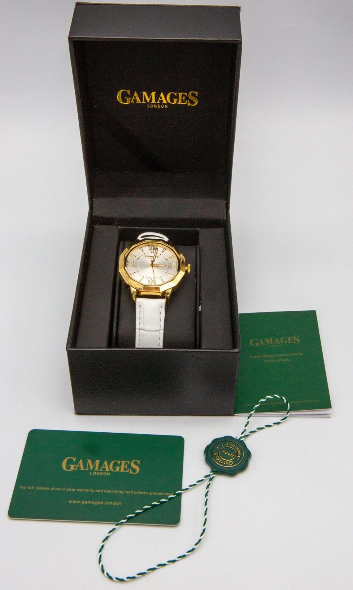 A Gamages of London Quartz Ladies Watch. White leather strap. Gilded case - 38mm. Silver tone - Image 3 of 5