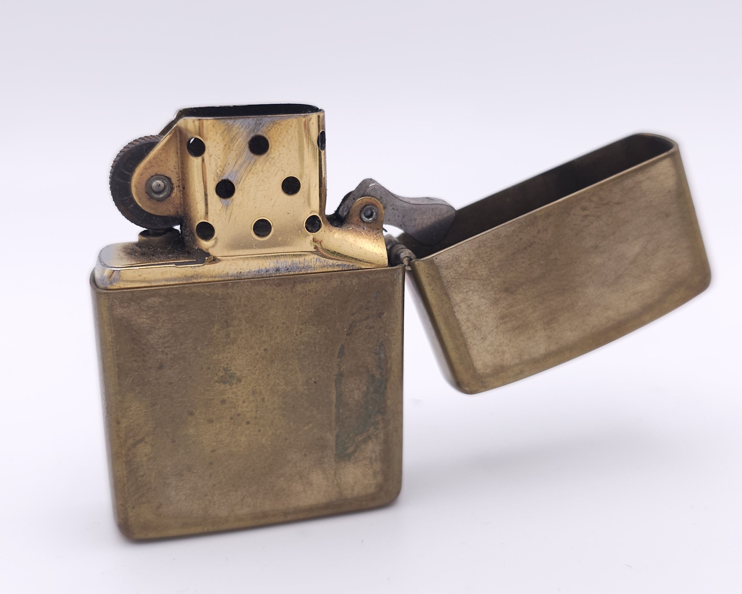 A Vintage Brass Zippo Lighter. USA Made. Marked X. Comes with a Vintage Zippo Lighter Collection