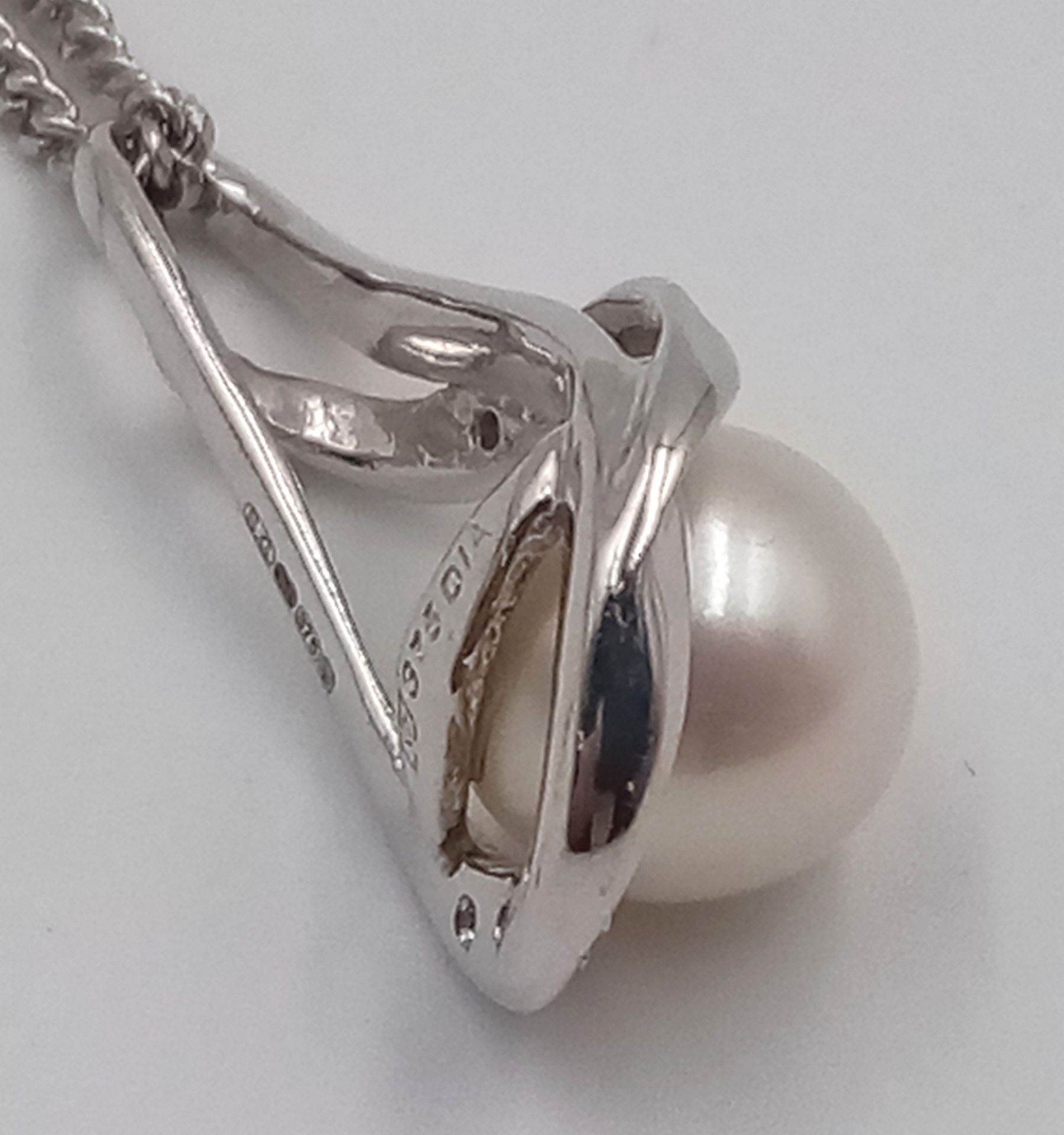 A 9ct White Gold Diamond and Pearl Necklace, 6mm pearl size, 0.05ct diamond, 20” chain length, 4. - Image 2 of 4