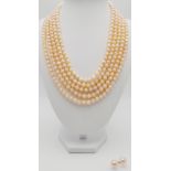 A statement five row pink, cultured pearl necklace accompanied by a pair of pink pearl stud