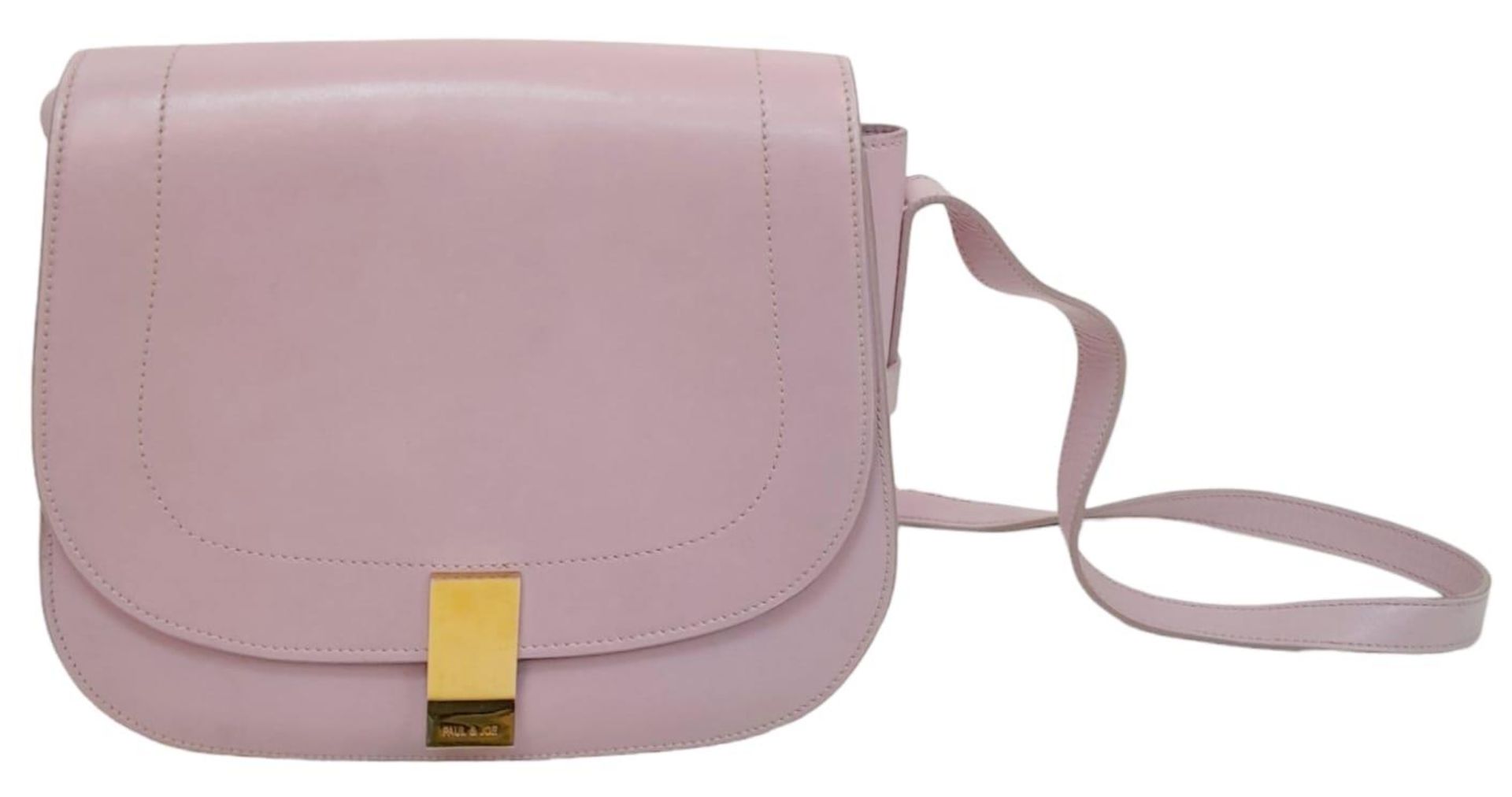 A Paul & Joe Lilac Saddle Bag. Leather exterior with adjustable strap, open compartment on back, and