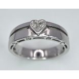 A 18K WHITE GOLD DIAMOND RING, DIAMONDS SET IN HEART SHAPE CENTRE AND DIAMONDS SET ON TWO SIDE 4.