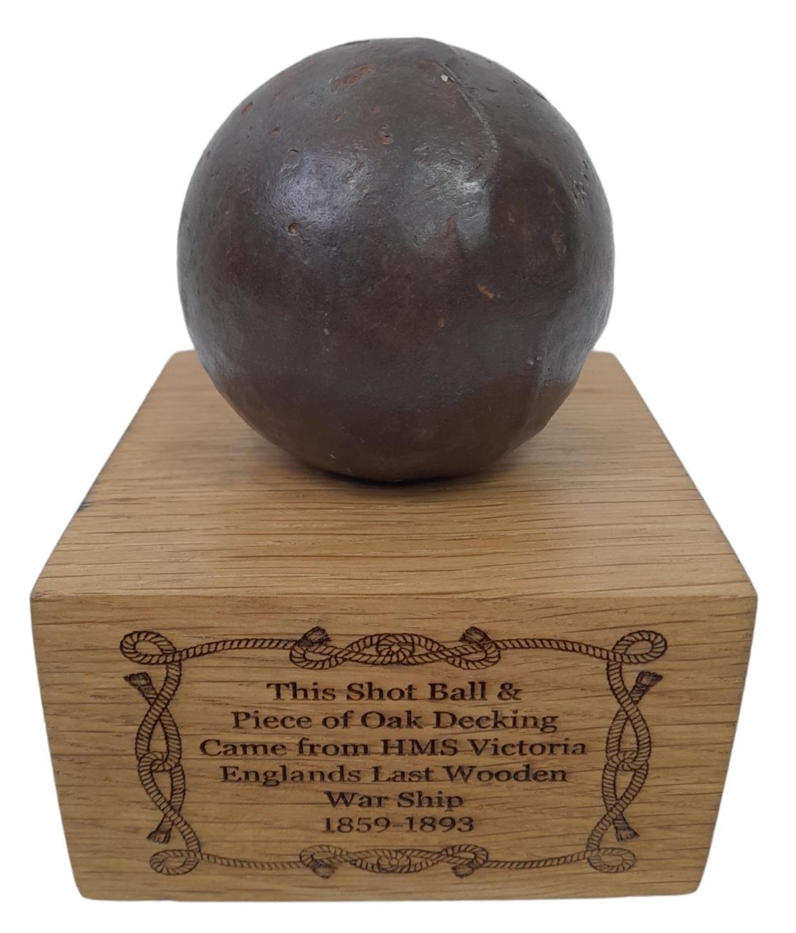 Iron Shot Ball Mounted on a piece of Oak Decking Board that was taken from the British Warship HMS