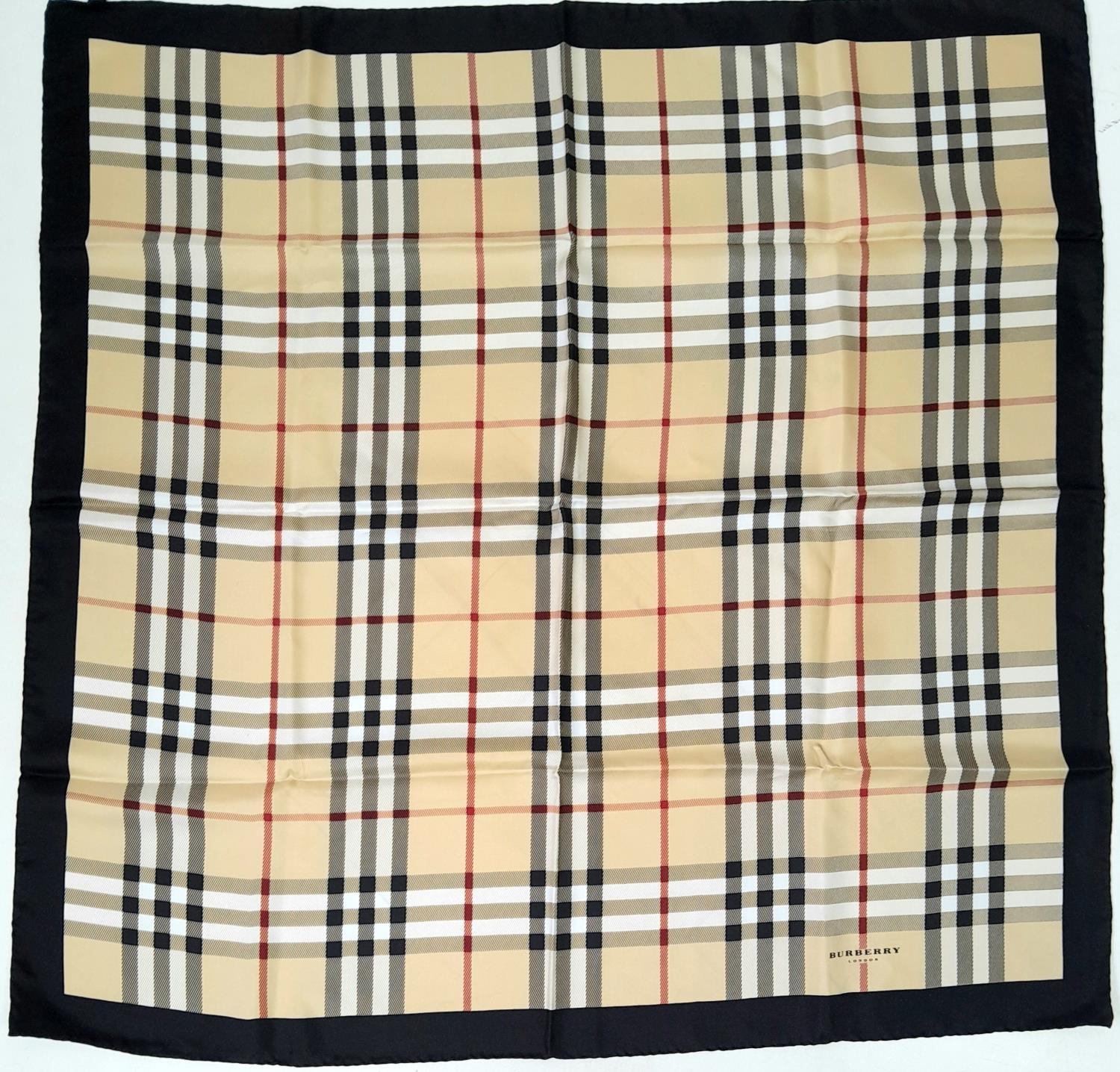 A Burberry Nova Check Scarf. 100% silk, made in Italy. Approximately 90cm x 90cm. Please see