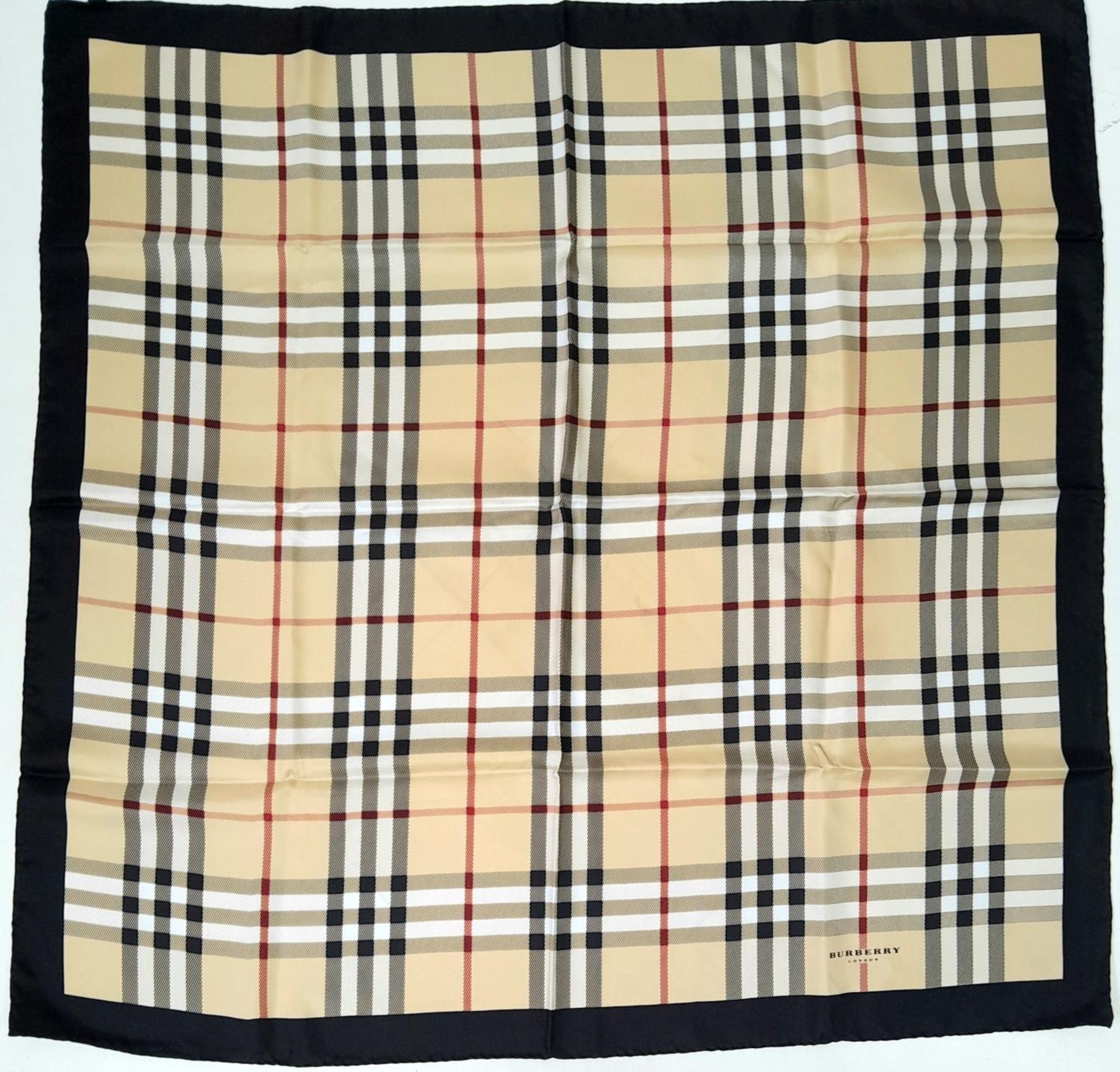 A Burberry Nova Check Scarf. 100% silk, made in Italy. Approximately 90cm x 90cm. Please see