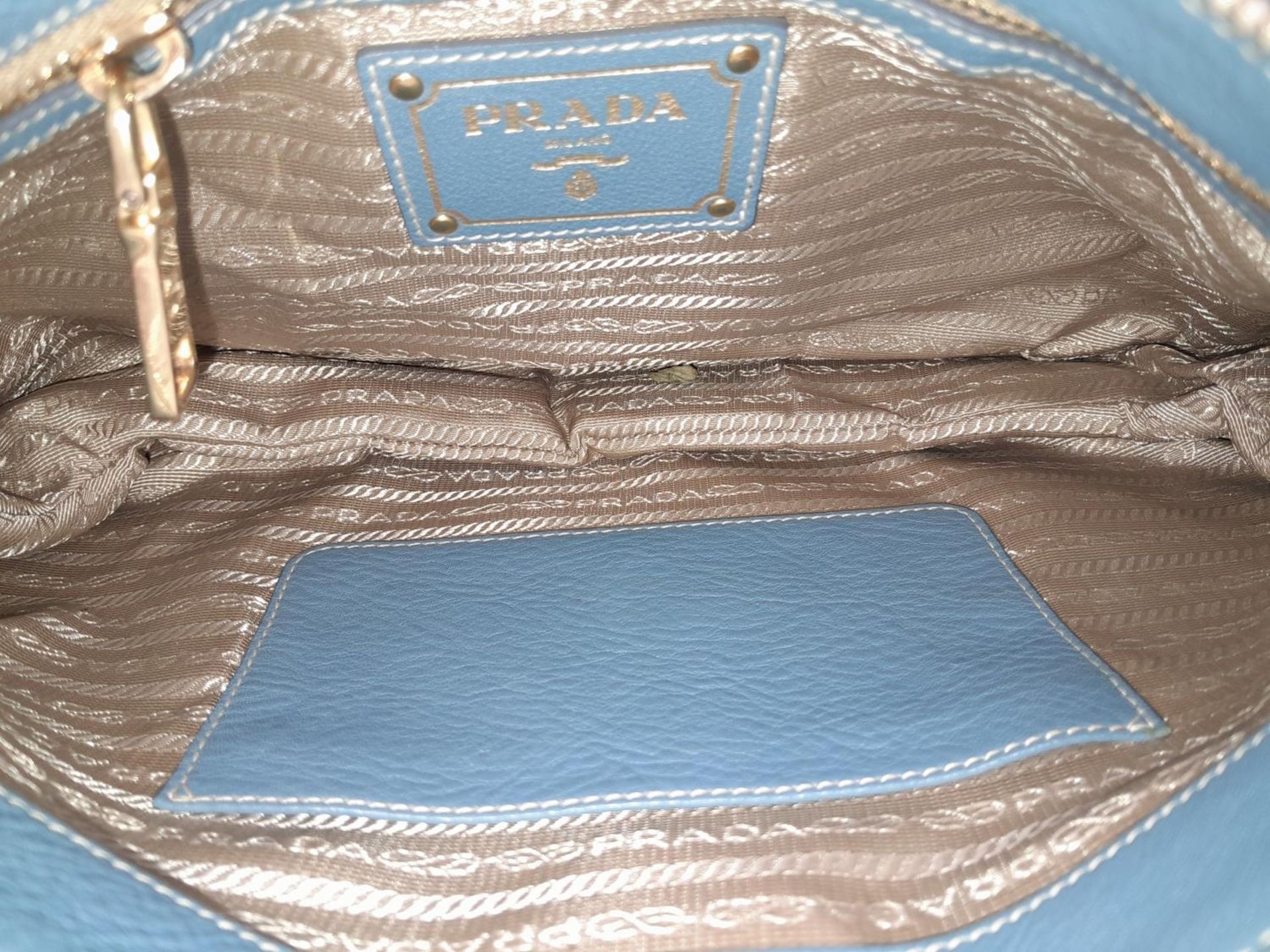 A Prada Marine Blue Vitello Daino Shoulder Bag. Leather exterior with gold-toned hardware, - Bild 7 aus 8