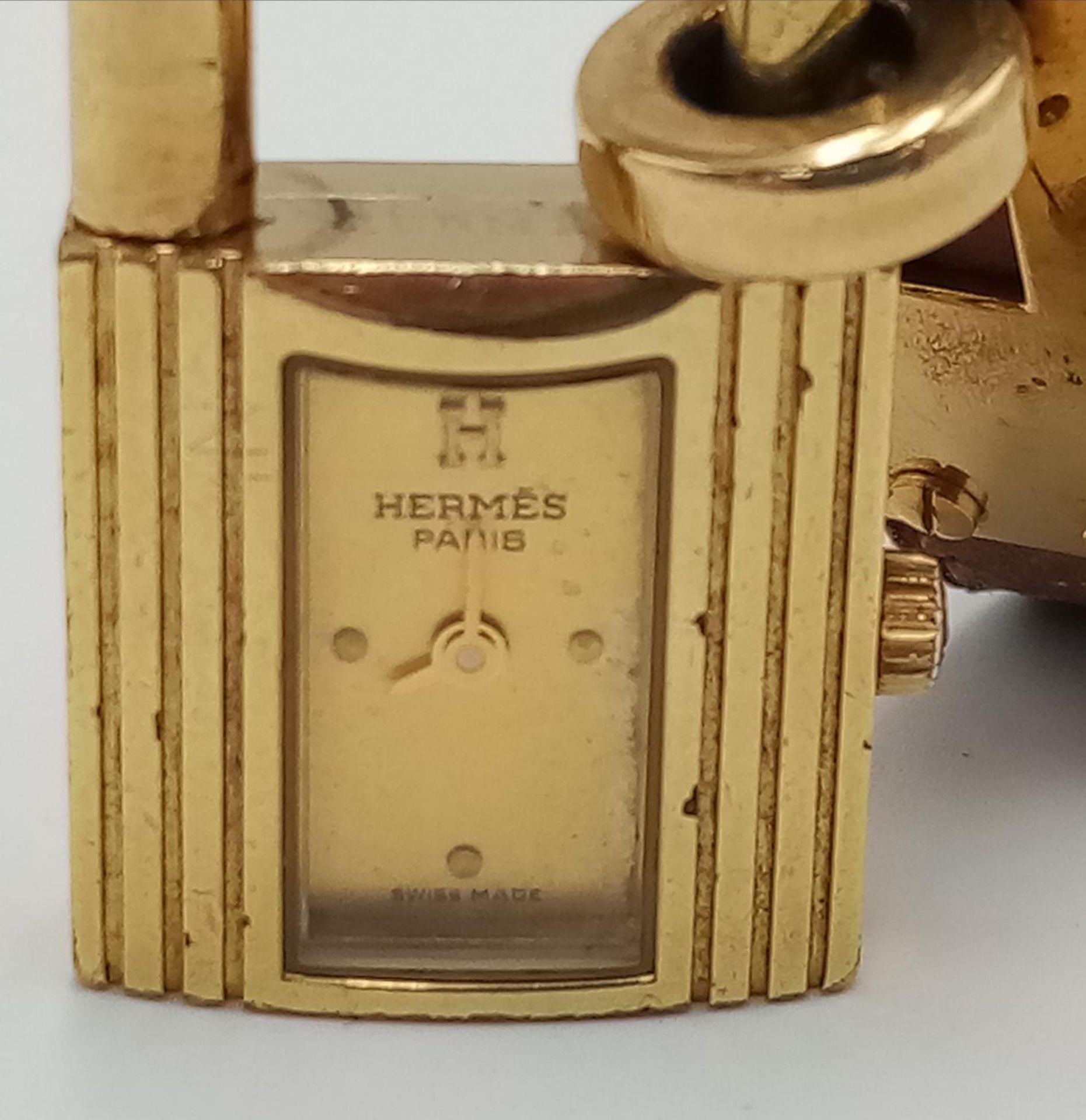A Hermes Kelly Watch. Brown leather strap. Gold plated padlock quartz watch. Needs a battery so as - Image 3 of 7