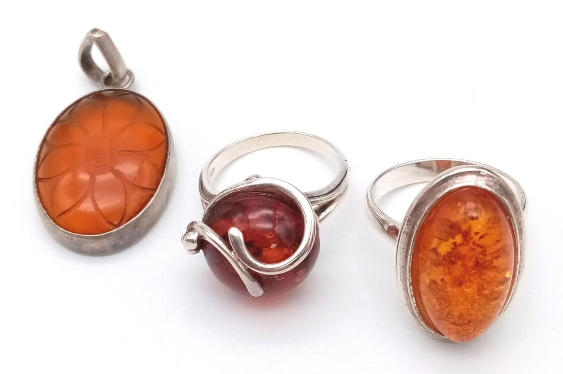 Two Amber Rings and One Pendant. R and T. 4cm pendant.