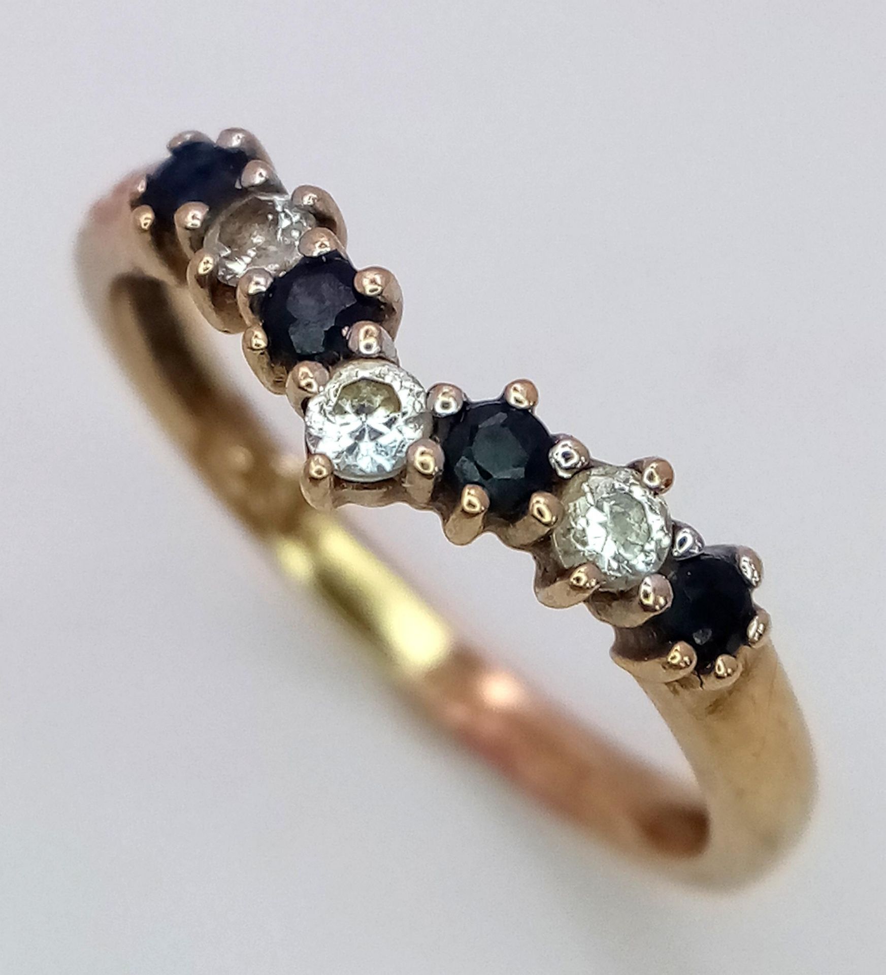 A 9K Yellow Gold Sapphire and White Zircon Chevron Ring. Size M. 1.5g total weight. - Image 3 of 6