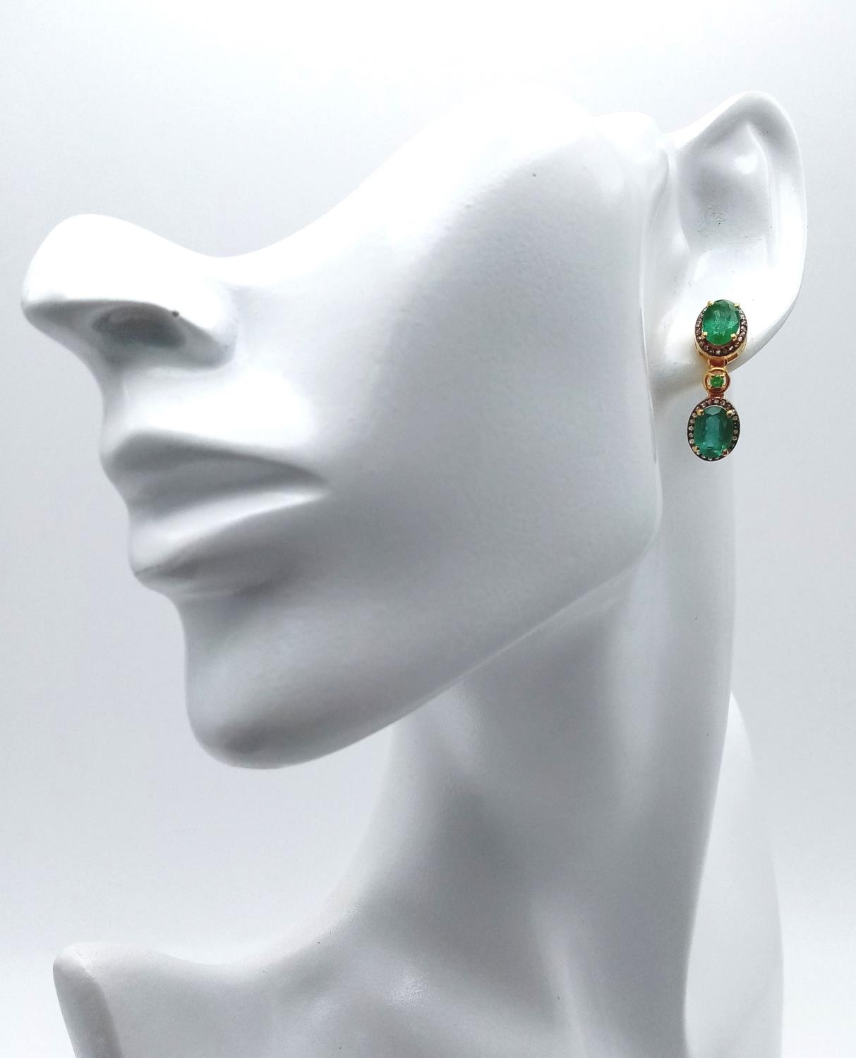 A Pair of Emerald and Diamond Drop Earrings - Set in gilded 925 Silver. Emeralds - 4ctw. - Image 2 of 4
