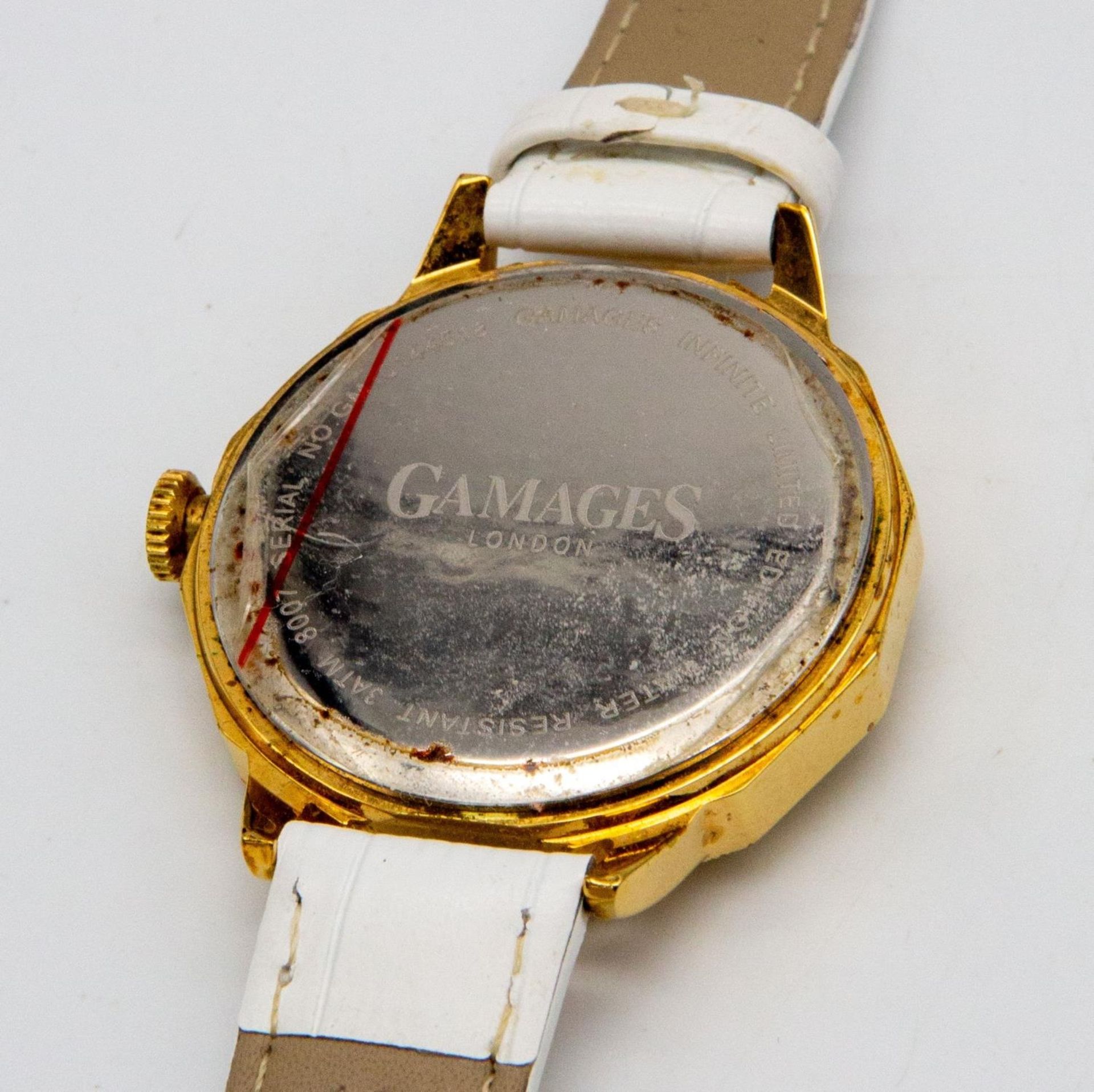 A Gamages of London Quartz Ladies Watch. White leather strap. Gilded case - 38mm. Silver tone - Image 2 of 5