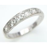 AN 18K WHITE GOLD DIAMOND BAND RING. 0.50CT. 3.2G. SIZE O.