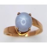 A Gorgeous 9K Yellow Gold Moonstone Cabochon Crossover Ring. Size P. 3.5g total weight.