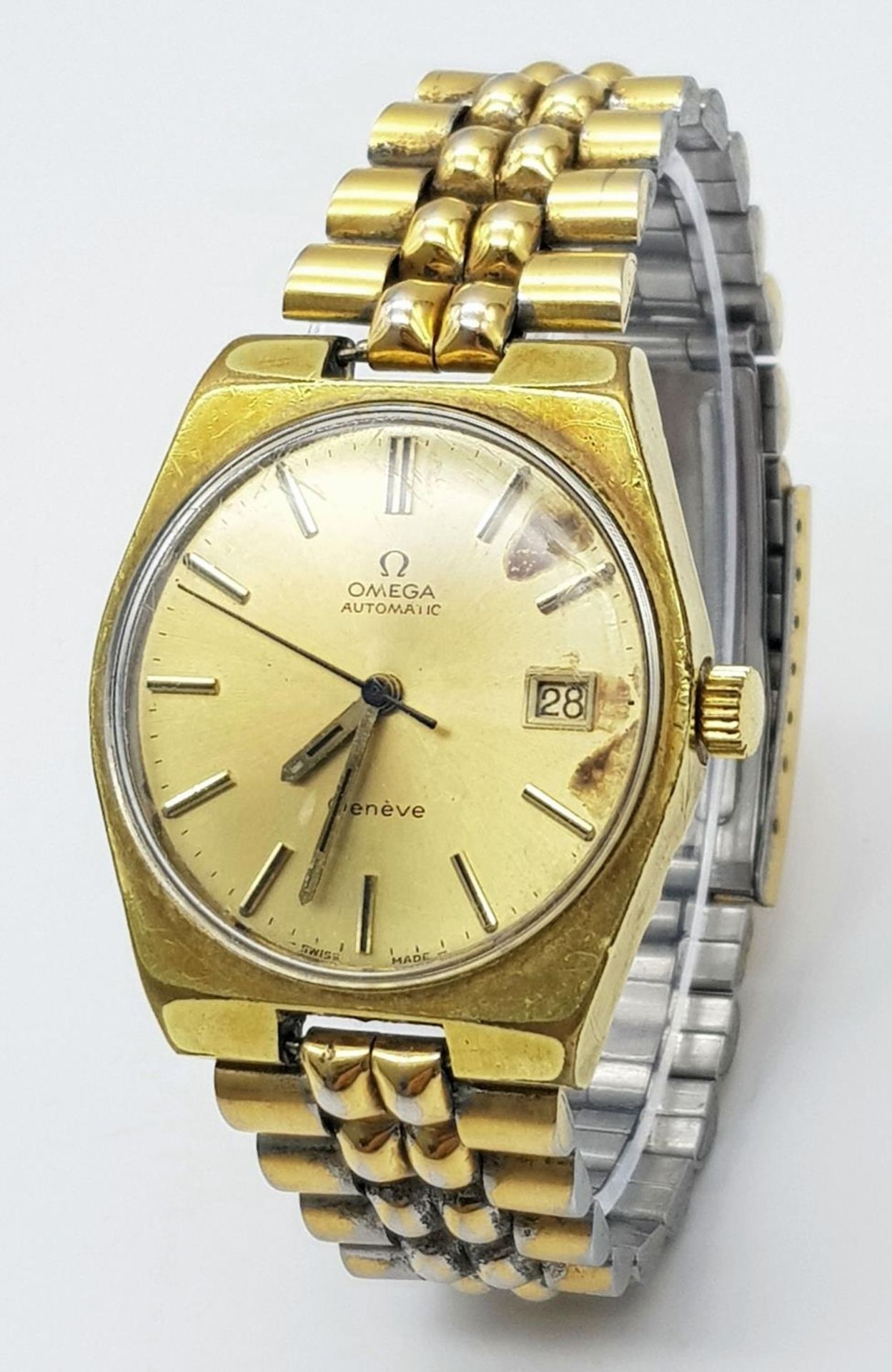 A Vintage Automatic Omega Geneve Gents Watch. Two tone bracelet and case. Gilded dial. In working