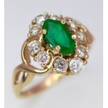 A 14K Yellow Gold Emerald and White Stone Ring. 1.2ct emerald. Size O, 3.34g total weight.