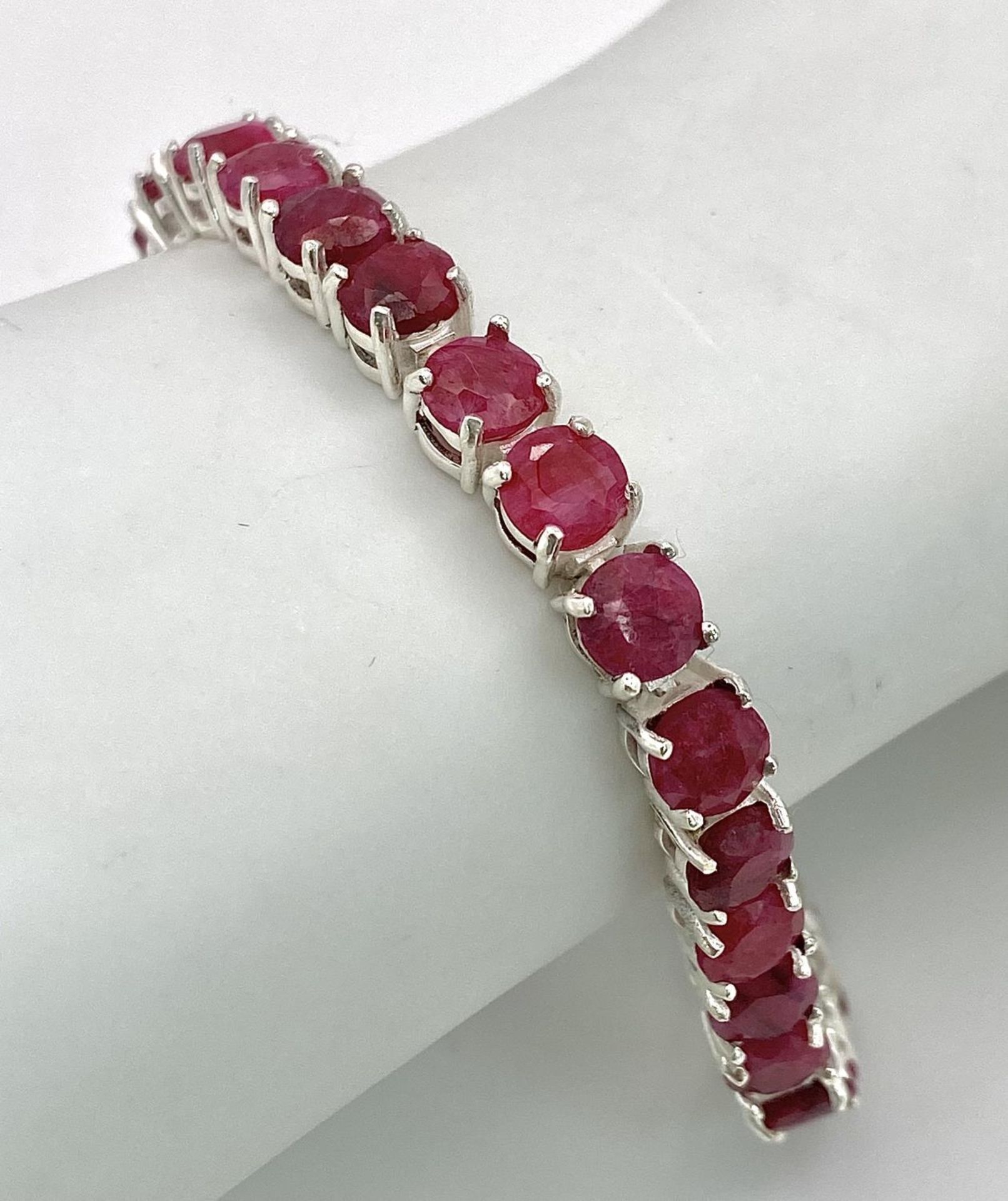 A Ruby Gemstone Tennis Bracelet. Set in 925 Silver. 18cm. Ref: CD-1313