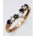 A 9K Yellow Gold Sapphire and White Zircon Chevron Ring. Size M. 1.5g total weight.