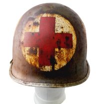 WW2 US M1 Swivel Bale Medics Helmet with Capac Liner. The helmet has the correct front edgeseam