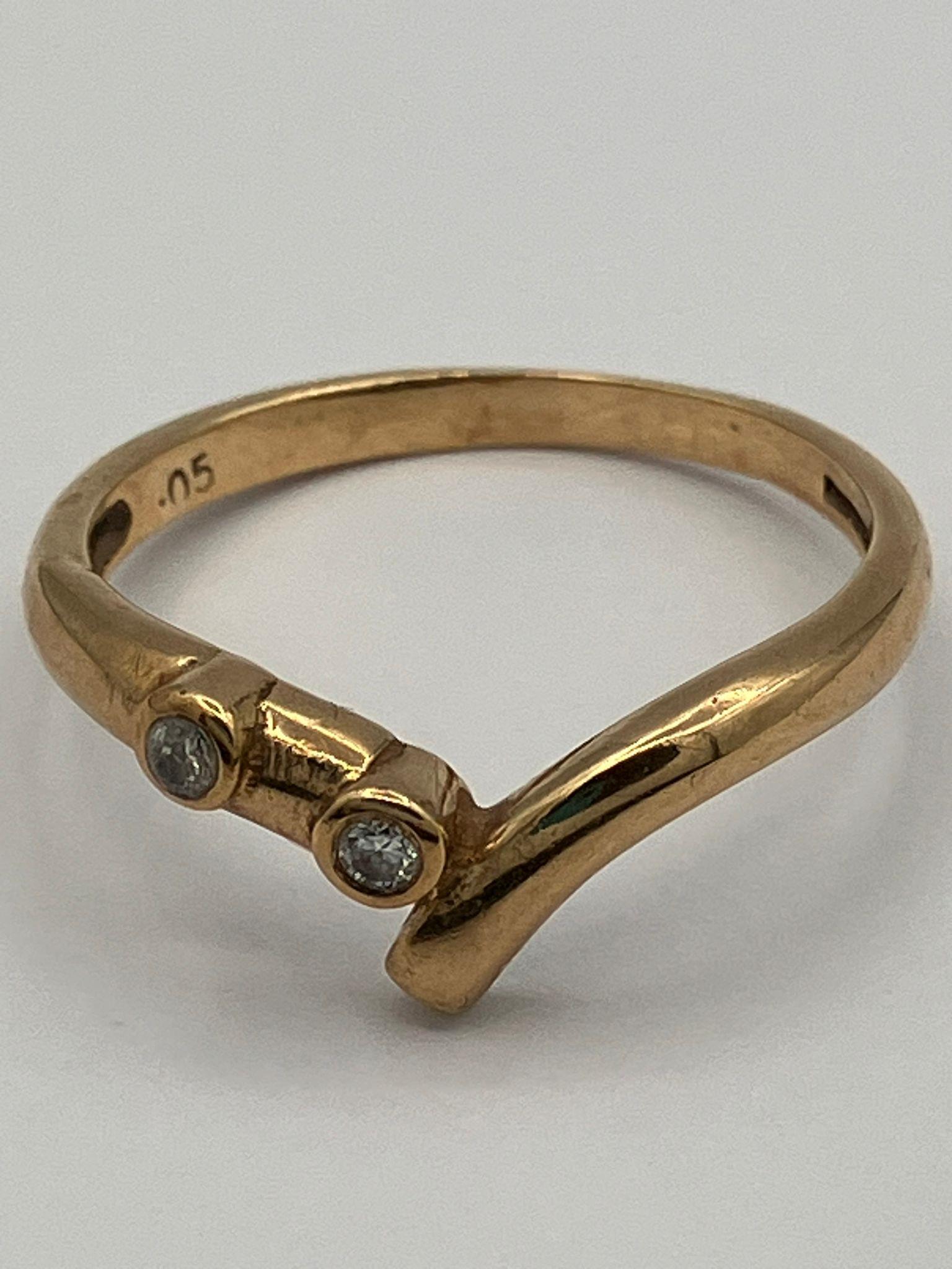 9 carat yellow GOLD and DIAMOND RING. A modernist version of the Classic WISHBONE RING set with 2