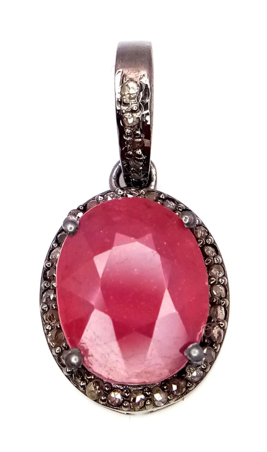 A Ruby and Rose Cut Diamond Pendant. Oval cut. Set in 925 Sterling Silver. 4.90ct ruby. Diamonds - - Image 2 of 4