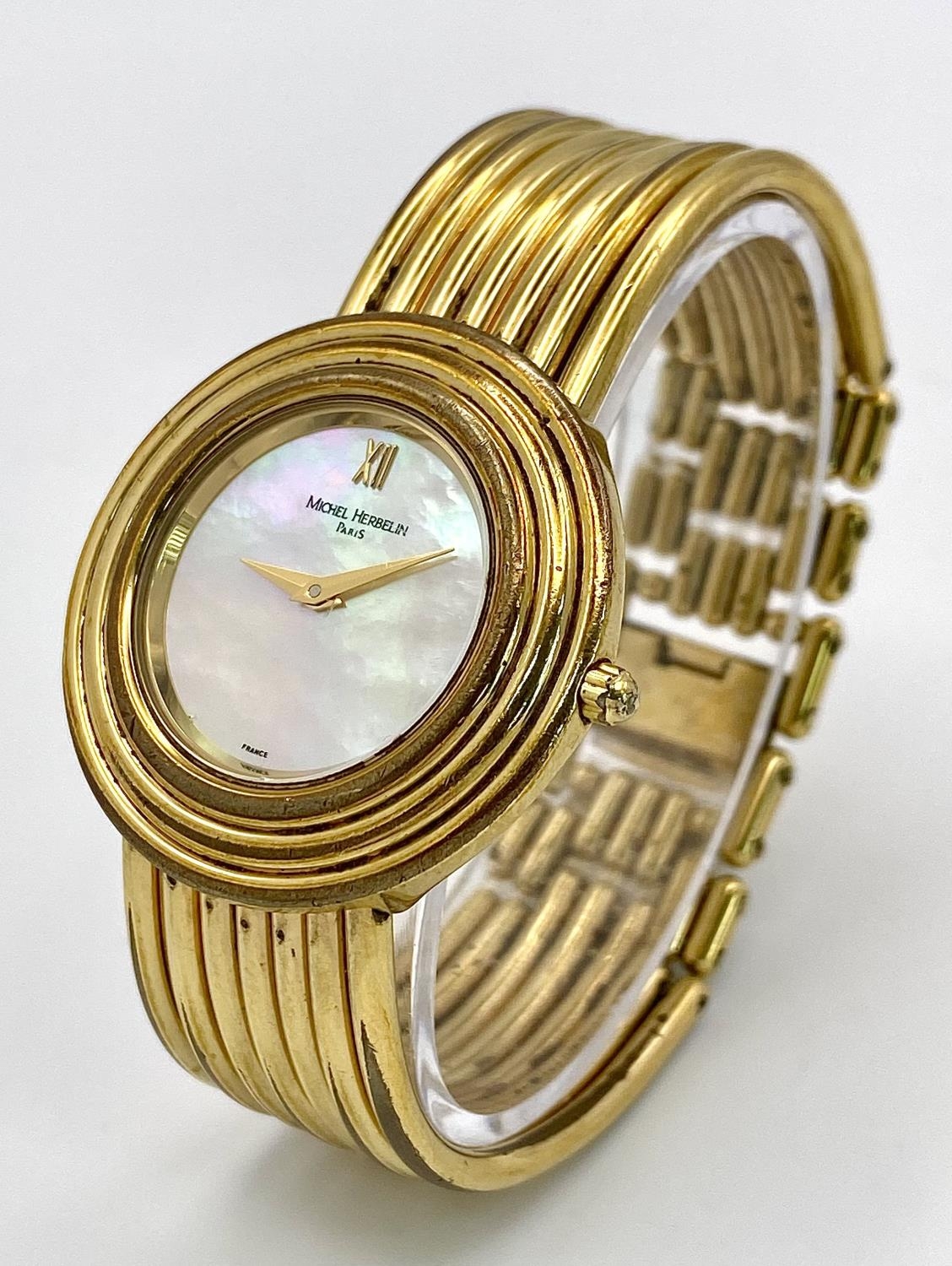 A Michel Herbelin Gold Plated Quartz Ladies Watch. Circular case diameter - 32mm. Mother of pearl