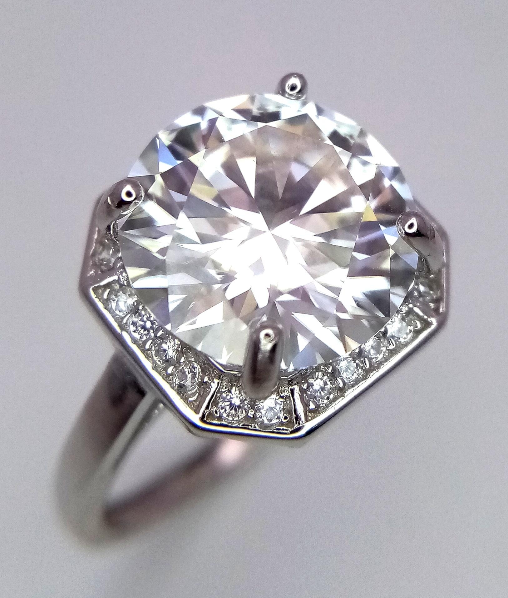 A 5ct Moissanite 925 Silver Ring. Size P. Comes with a GRA certificate.