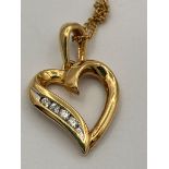 9 carat GOLD HEART PENDANT amounted on a 9 carat Fine GOLD CHAIN NECKLACE. 1.4 grams. Pendant 1.6 cm