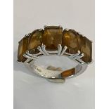 Impressive SILVER and SMOKY QUARTZ RING. Having 5 x Emerald and oval cut gemstones set to top and