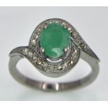 An Emerald Ring with a Rose Cut Diamond Surround. Set in 925 Sterling silver. Emerald - 0.70ct.
