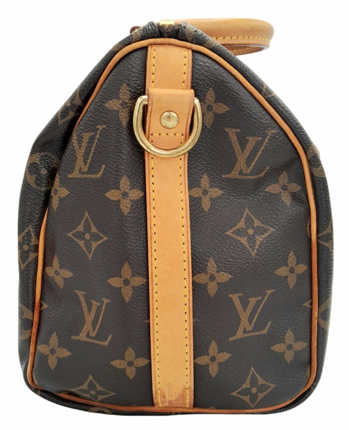 A Louis Vuitton Speedy Bag. Monogramed canvas exterior with gold-toned hardware, two rolled - Image 3 of 12