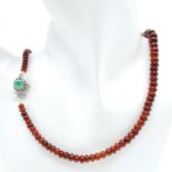 A 210ctw Hessonite Garnet Graduated Rondelle Necklace - with Emerald and 925 Silver clasp. 42cm.