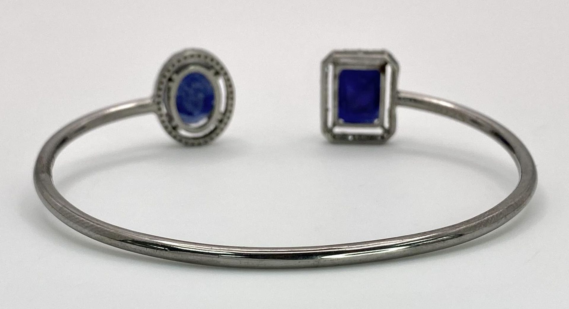 A 15ctw Blue Sapphire with 0.65ct Diamond Surround Silver Cuff Bangle. Comes with a presentation - Image 3 of 5