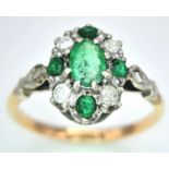 A 9K Yellow Gold Emerald and Diamond Ring. Size M, 2.09g total weight.