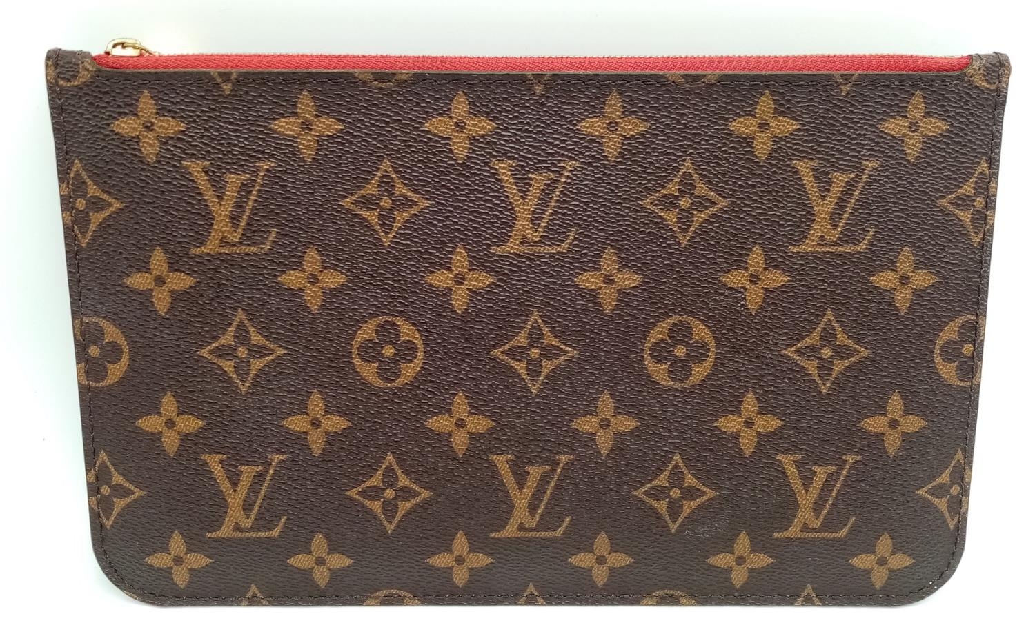 A Louis Vuitton Neverfull Pochette. Monogramed canvas exterior with gold-toned hardware and zip