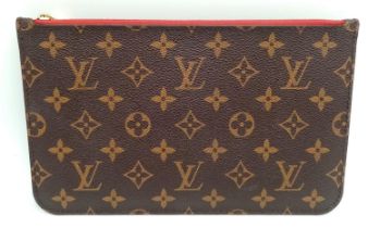 A Louis Vuitton Neverfull Pochette. Monogramed canvas exterior with gold-toned hardware and zip