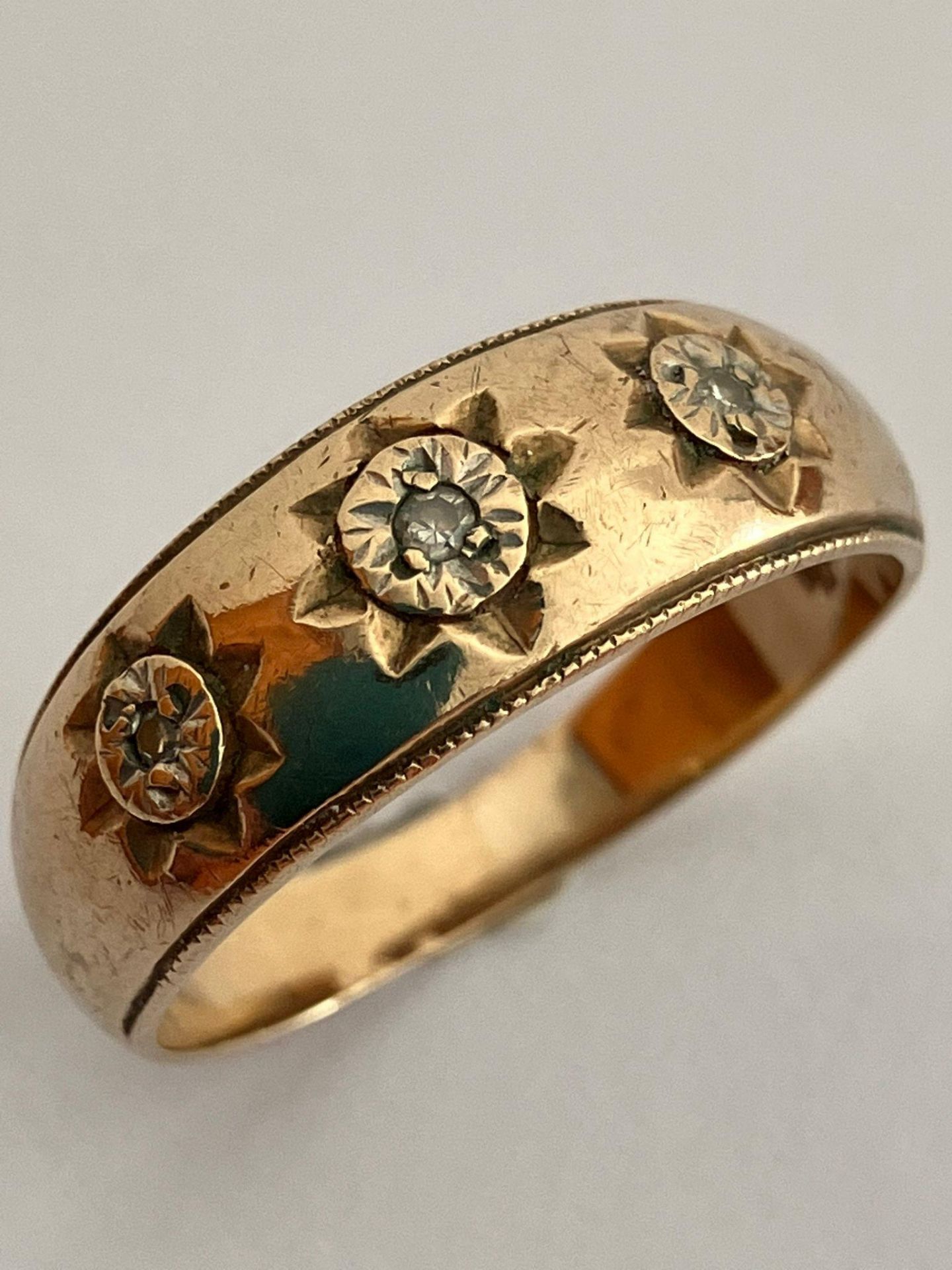 9 carat GOLD and DIAMOND GYPSY RING. Having 3 x Diamonds set to top. Full UK hallmark. 3.0 grams.