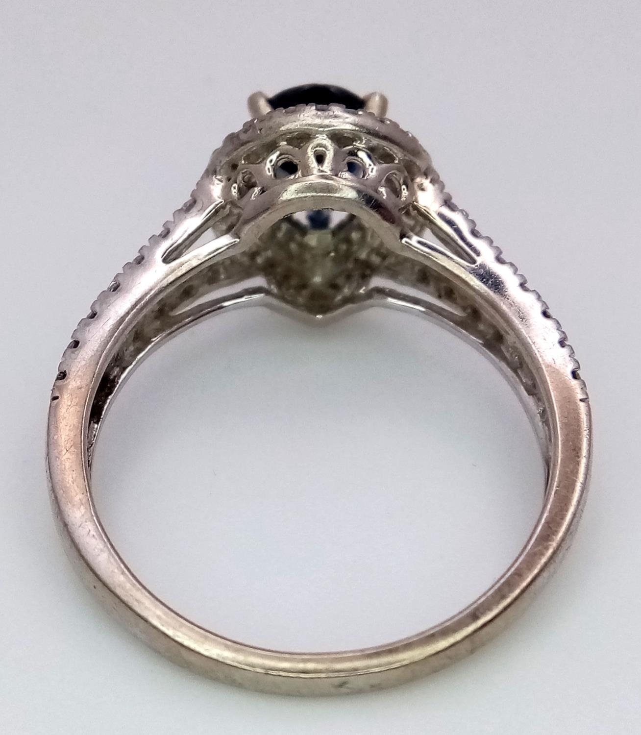 An 18K White Gold Sapphire and Diamond Ring. Teardrop sapphire with a 0.50ctw diamond surround. Size - Image 4 of 5