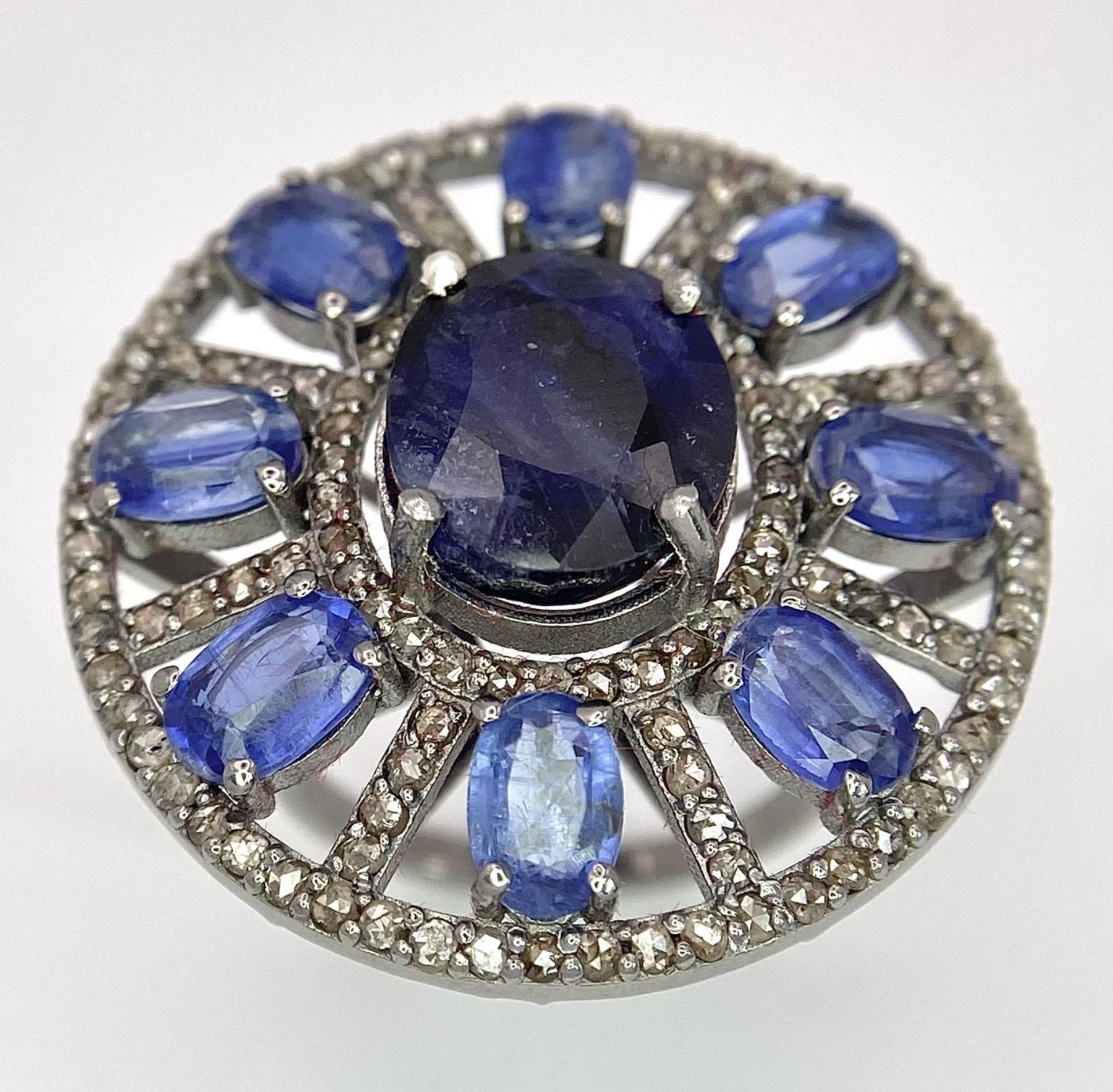 A 10ct Topaz Ring with 6.15ctw of Kyanite surround and 0.50ctw of Diamond Accents. Set in 925 - Image 2 of 6