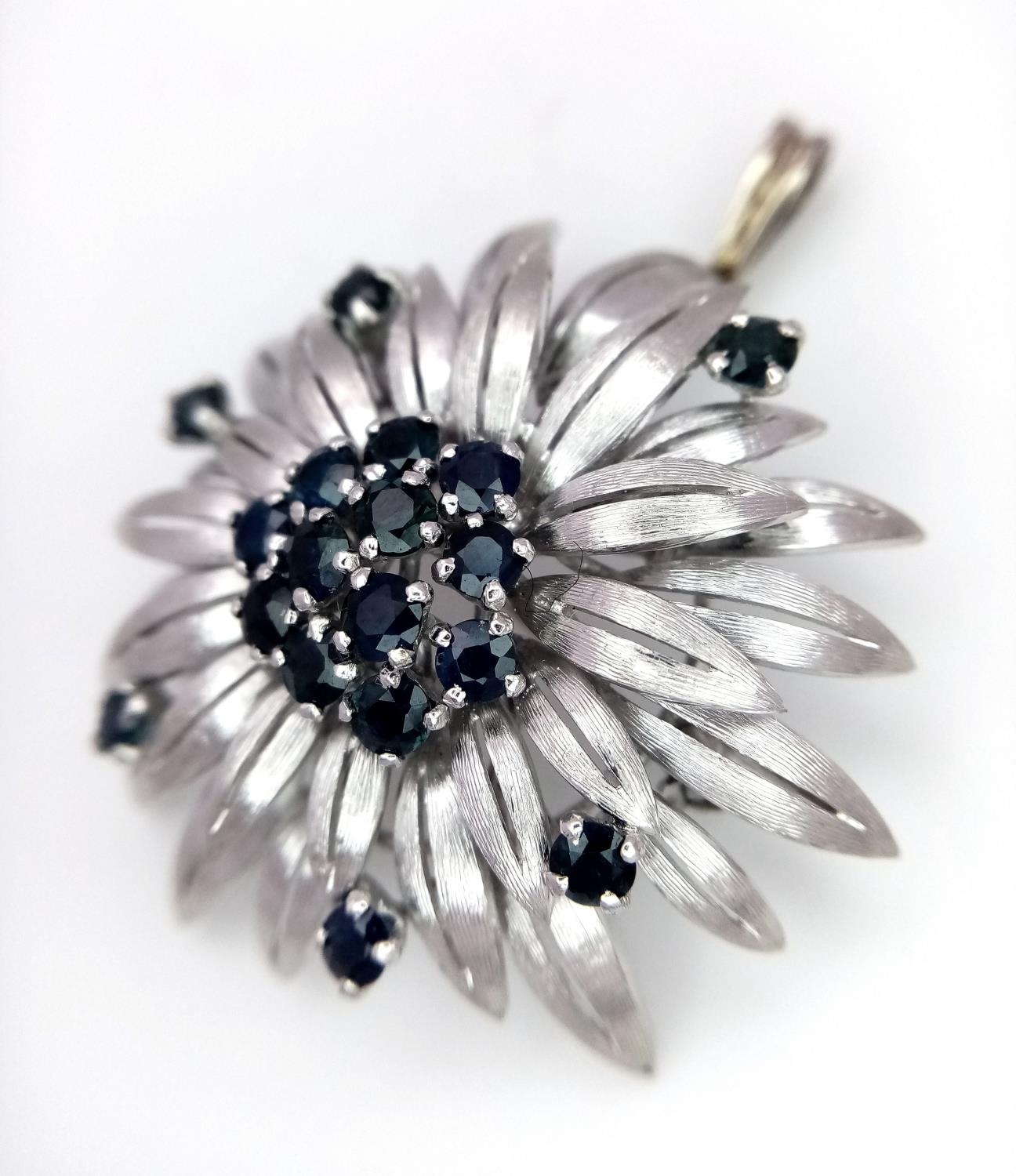 A 14ct white gold (tested as) sapphire flower brooch that has a bail that can be worn as a - Image 2 of 5