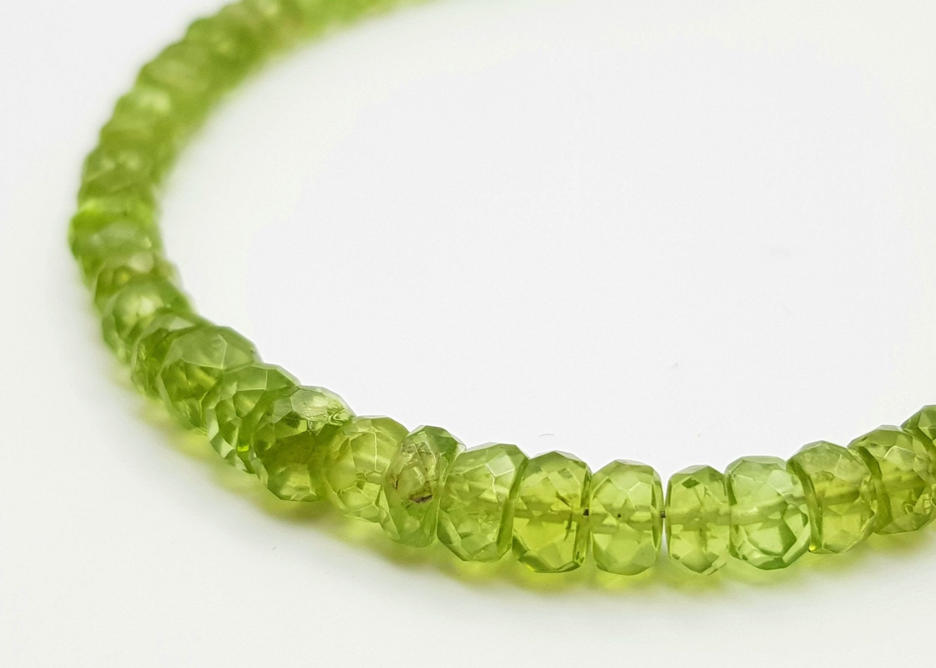 A Peridot Gemstone Tennis Bracelet with a Peridot Rondelle Necklace. Both with silver clasps. - Image 5 of 6