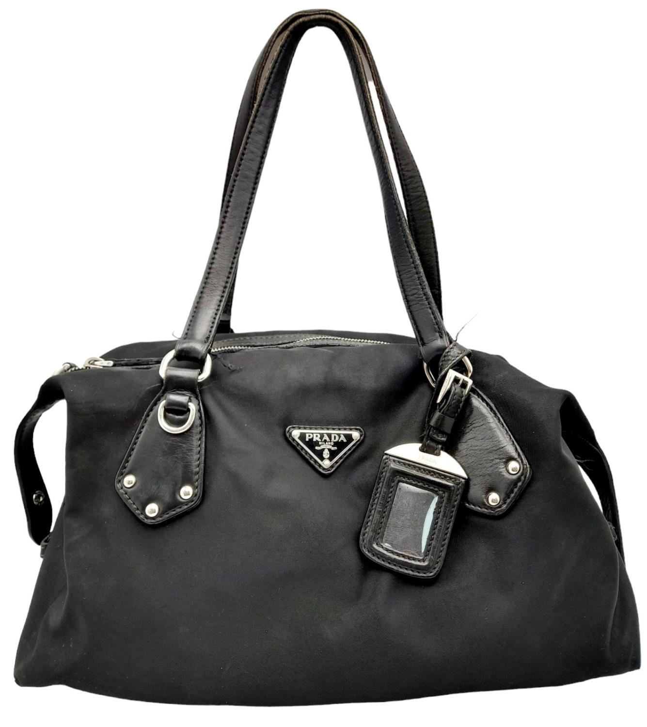 A Prada Black Tessuto Satchel. Textile exterior with leather trim, silver-tone hardware, a top zip