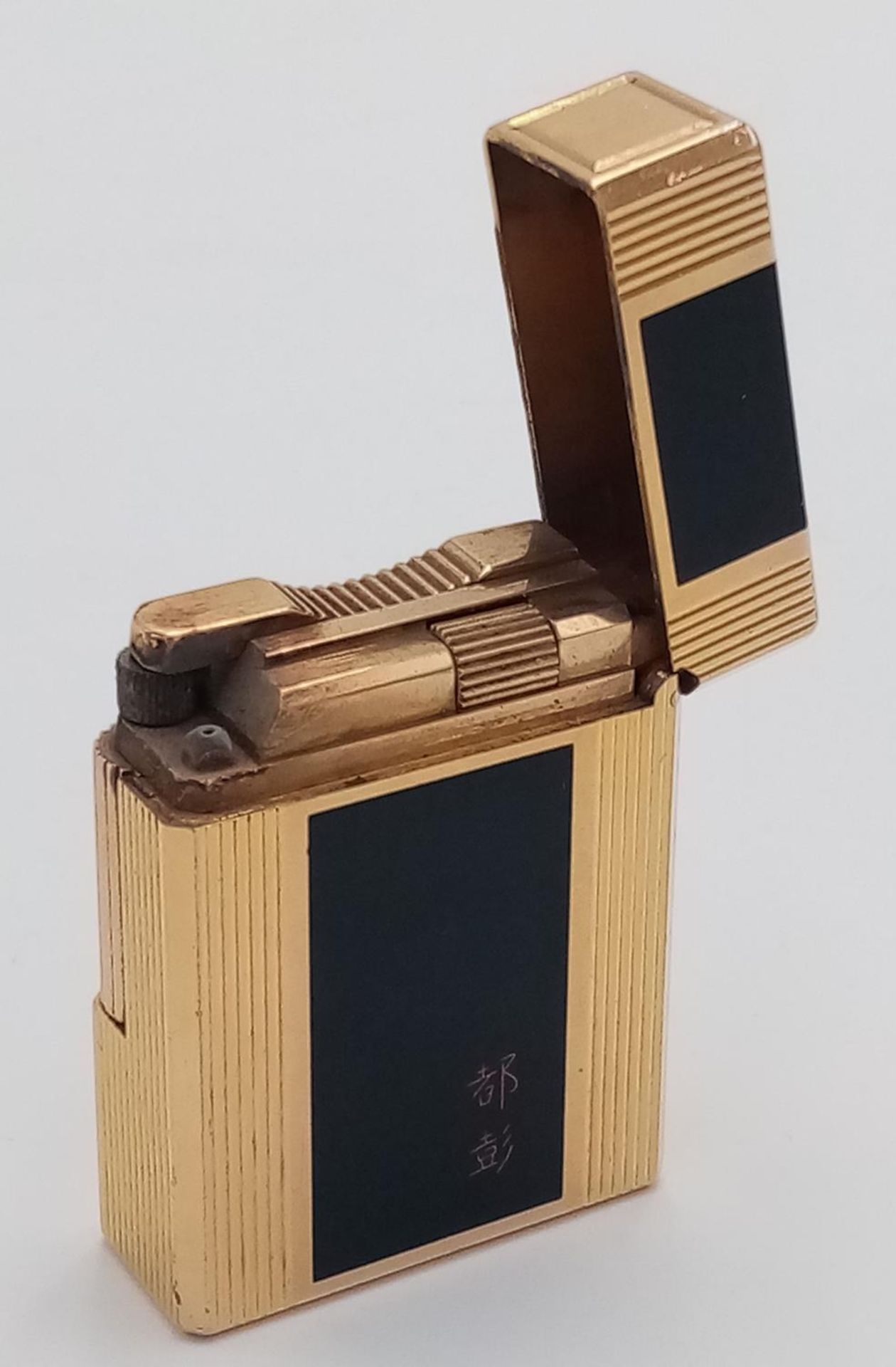 An S.T. Dupont Gold Plated and Black Enamel Lighter. Needs gas and flint. UK MAINLAND SALES ONLY - Image 5 of 5