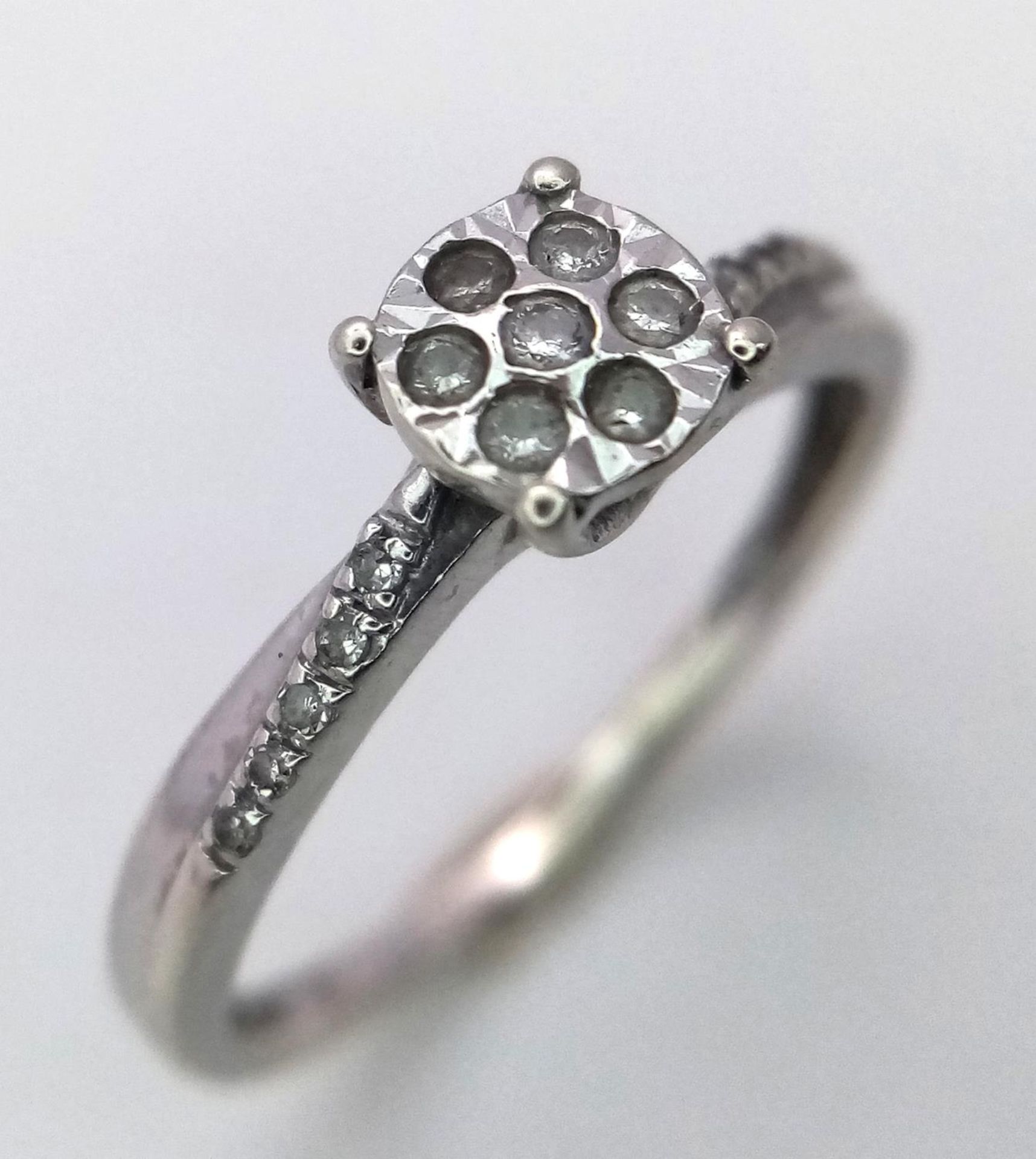 A 9K WHITE GOLD DIAMOND RING. Size K, 1.3g total weight. Ref: SC 9011