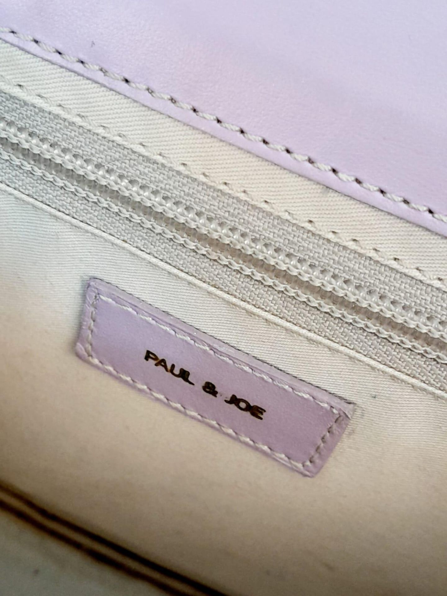 A Paul & Joe Lilac Saddle Bag. Leather exterior with adjustable strap, open compartment on back, and - Image 6 of 6